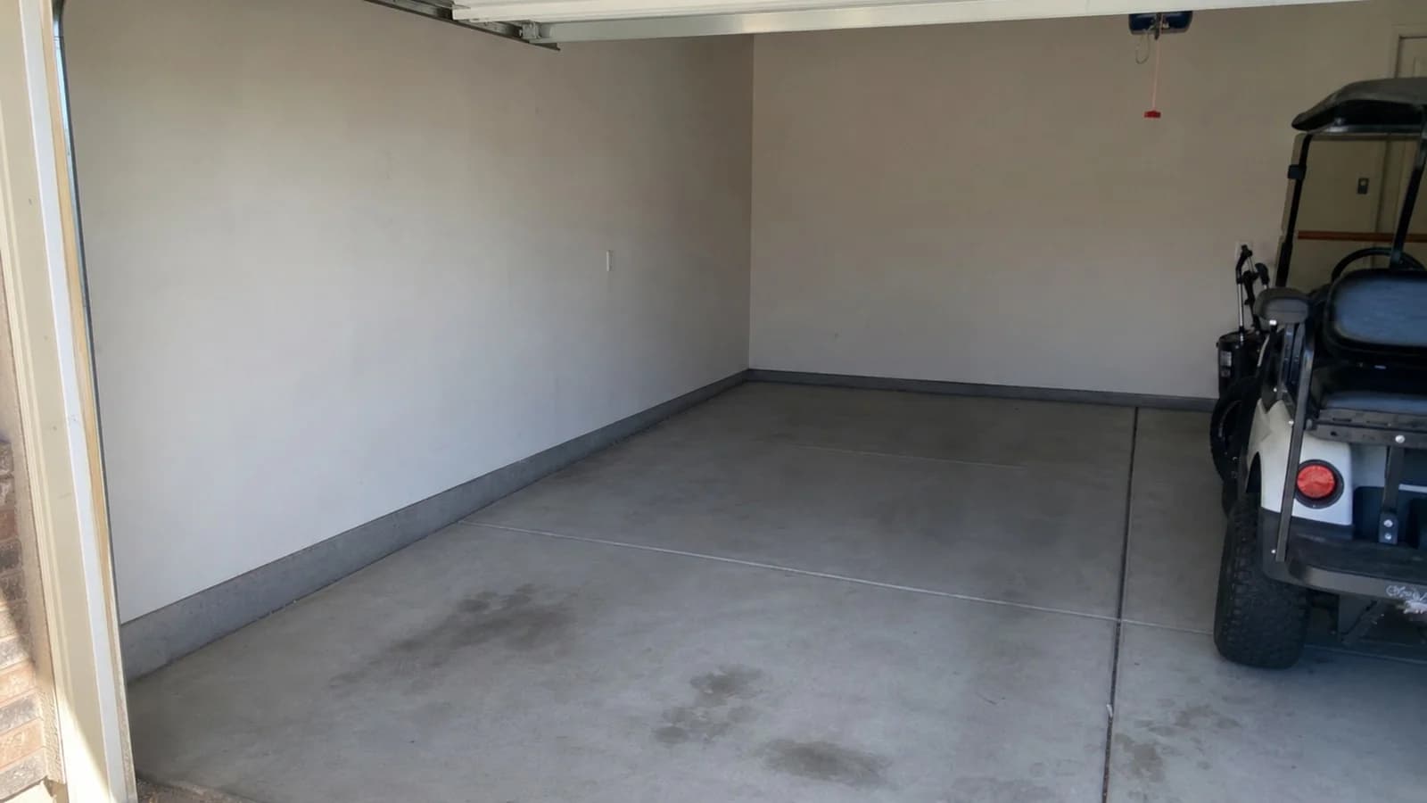 Clean garage after boxes, a mattress, toys, and household junk were hauled away.