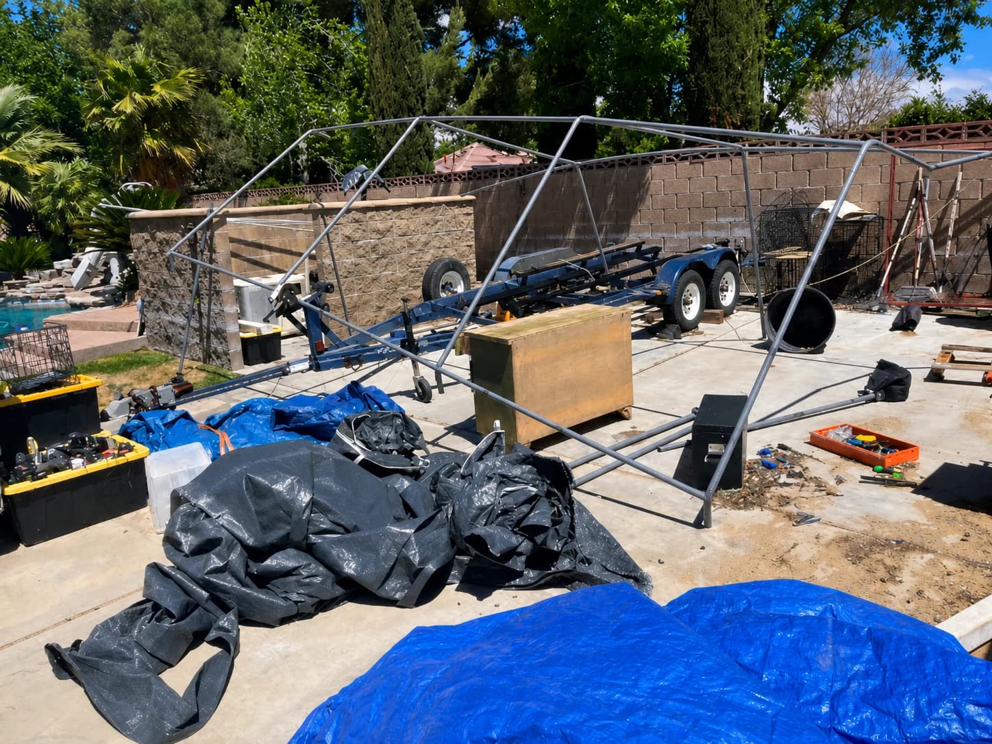 Cluttered backyard patio before Pinky's Junk Removal clears the junk.