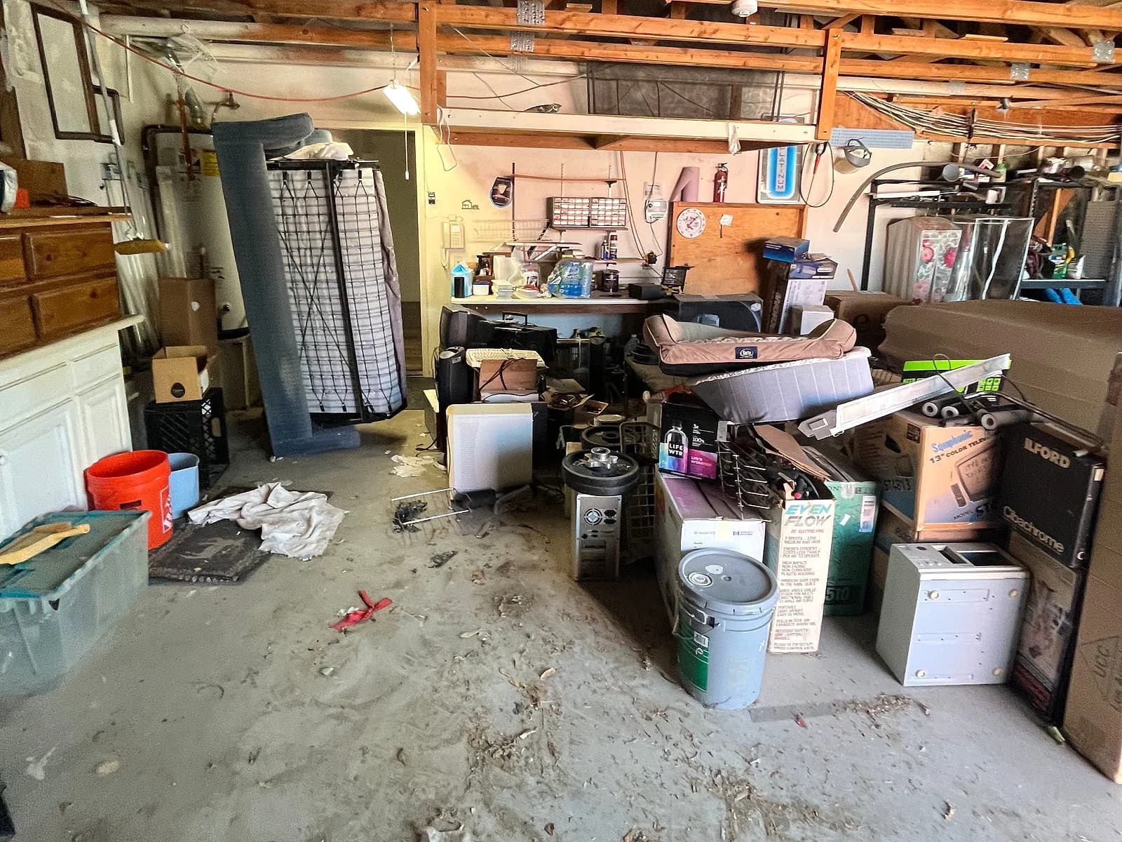 Cluttered Antelope Valley residential garage before a junk-removal cleanout.