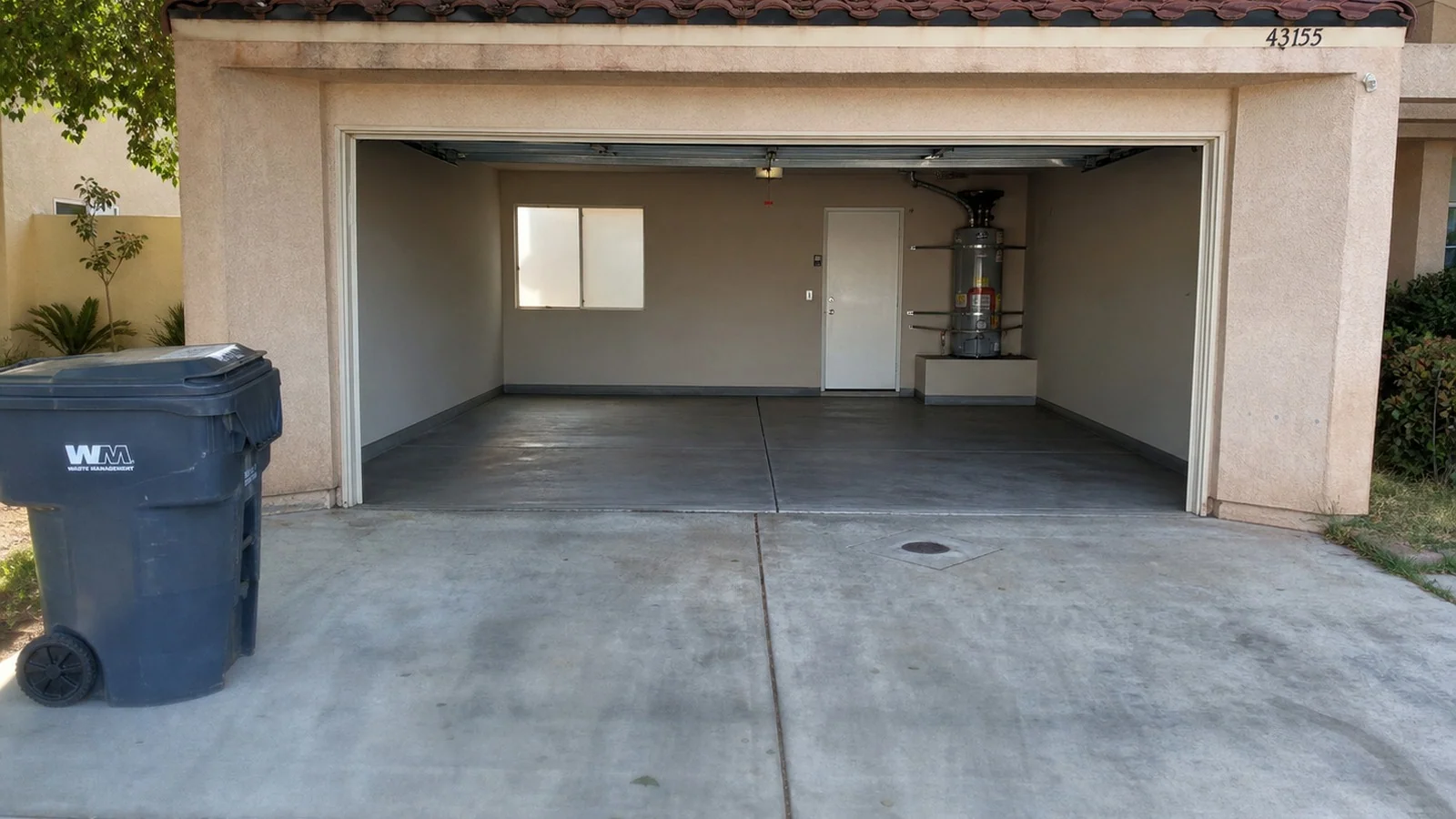 Palmdale garage and driveway after Pinky's Junk Removal cleared and swept the space.